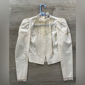 Vintage off white blouse with leg of mutton sleeves.  Satin too with lace